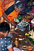 Worship and puja offerings inside the Swamimalai temple. 